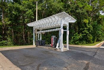 Covered car care center with a car vacuum at Crystal Lake in Pensacola, Florida.